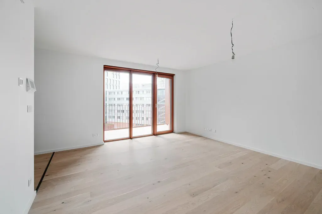 Empty living room with large windows